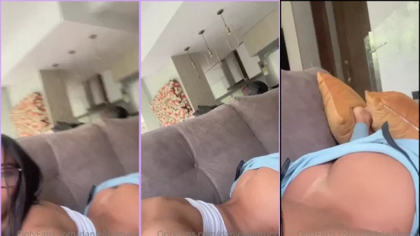 Daniela Antury showing the tail on the couch